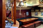 Salon van de Spartivento met bar en eettafel